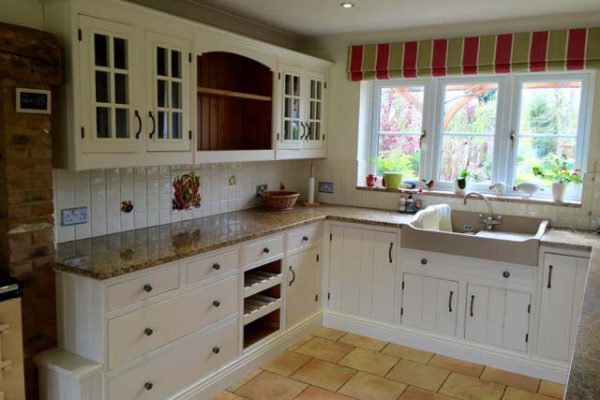 Kitchen resprayed with a clean traditional white look