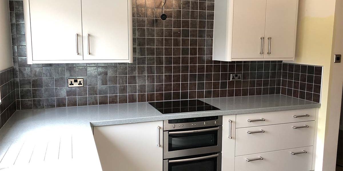 after image of kitchen now resprayed with white