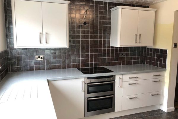 after image of kitchen now resprayed with white